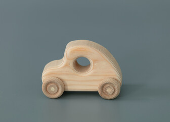 Wooden car isolate on grey background.