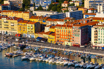 Fototapeta na wymiar Nice Port and yacht marina district sunset panorama with Mont Boron hill at French Riviera of Mediterranean Sea Harbor in France