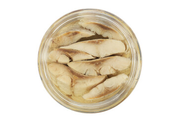 Sliced salted and pickled herring fish in jar isolated on white background. Salted fillet of herring.