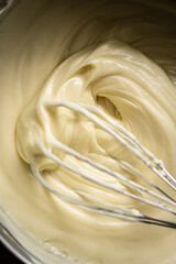 cream of white chocolate with whisk
