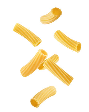 Falling raw Tubetti Rigati, uncooked Italian Pasta, isolated on white background, full depth of field