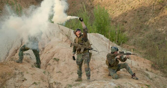 young people are learing to fight, men are taking part in war game slow motion