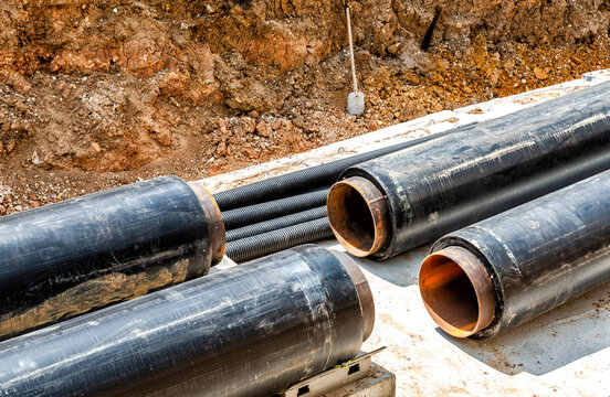 Construction works on large pipes at a depth of excavated trench