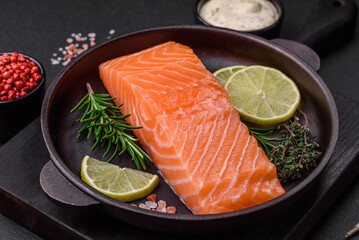 Fresh tasty raw red fish fillet with spices and herbs