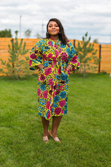 Portrait of beautiful african american woman having fun on village or suburbian. Outdoor portrait...