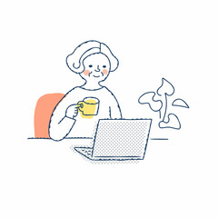 ノートパソコン作業をしているシニア女性