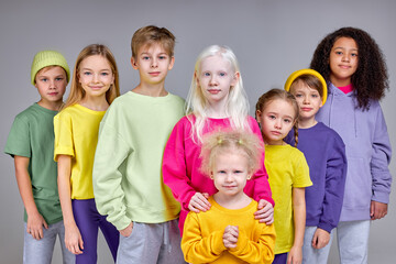 Group of children standing together, showing their unity, kids are against bullying, pedophilia isolated white background