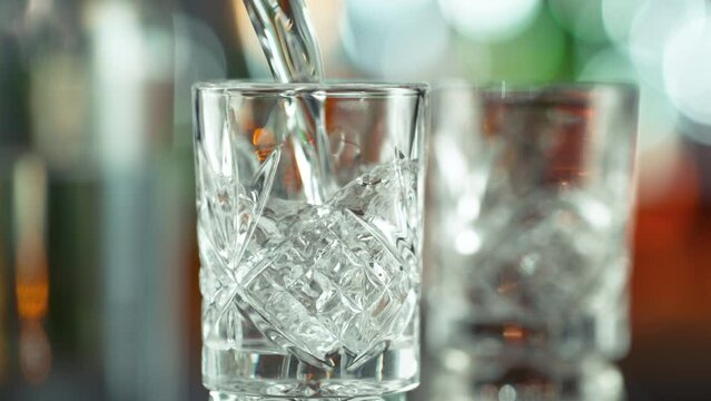 Super Slow Motion Shot of Pouring Vodka into Shot Glass on Bar at 1000fps.
