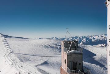 Ski slope and snow covered winter mountains. Matterhorn is a mountain in the Pennine Alps on the...