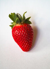 Strawberry on white background. Fresh sweet fruit closeup