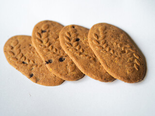 Cereal cookies with chocolate pieces on a white background. Healthy cookies