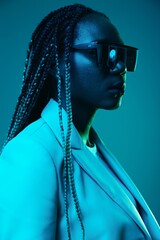African american woman portrait business smile and fashion wearing glasses on blue background in...