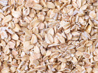 Raw oatmeal, grains, close up