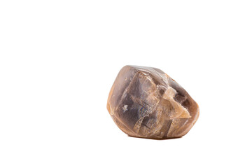 Macro tumbled dark peach moonstone crystal, aluminium silicate mineral, brown and peach gem isolated on a white background surface