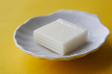 Homemade natural soap bar on black background 