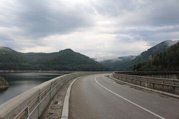 Enchanting Bridge by a Majestic Mountain: A Scenic Engineering Wonder