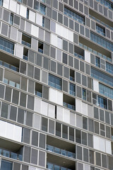 facade of a modern office and residential building with diagonal lines, a dynamic and fresh image of a skyscraper

