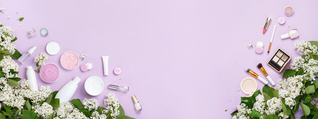 Top view banner of Natural woman make up cosmetics with spring white lilac bloom. Spring female decorative cosmetics on purple background. Organic cosmetics and brushes in lilac blossom - 585545866
