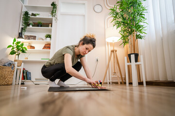 One woman female artist designer draw on the board on floor with chalk