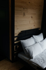 bed in bedroom wooden house, house in the mountains