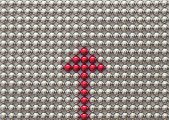 Red triangle arrow sign assembled from little magnetic balls