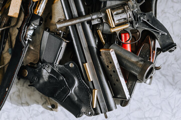 Weapons of various calibers, a rifle, a metal revolver with cartridges, barrels, pistols, hunting...