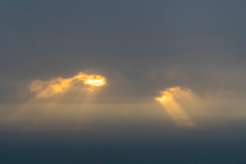 Large white clouds against a blue sky. Huge clouds like cotton wool in the sky.