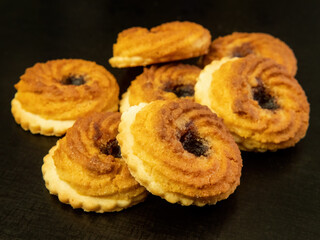 Delicious peacock eye cookies filled with cherry and bursting with fruity flavor