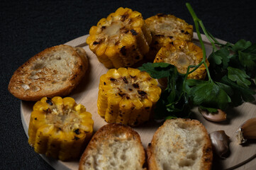 Delicious grilled corn with toast, parsley and garlic