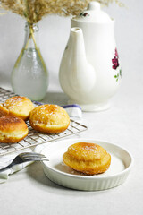 homemade Algeria Donut with apricot jam and powdered with sugar, reeds plant and coffee