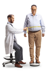 Doctor taking waistline measures from a mature man