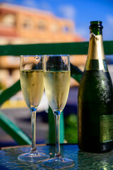 Dinner party, drinking of cava or champagne sparkling wine in vacation resort Caleta Fuste, Fuerteventura, Canary islands vacation, Spain