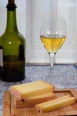 Wine and cheese pairing, local Comte cheese produced in the Franche-Comté region and special and...