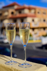 Dinner party, drinking of cava or champagne sparkling wine in vacation resort Caleta Fuste, Fuerteventura, Canary islands vacation, Spain