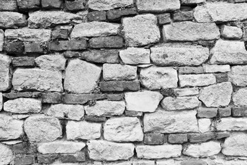 Old brick wall background, close-up. Masonry texture for publication, design, poster, calendar, post, screensaver, wallpaper, postcard, banner, cover, website. Gray toned high quality photography