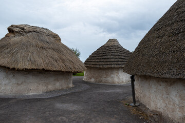 Fototapeta na wymiar Prehistoric huts reconstructed in Stonehenge