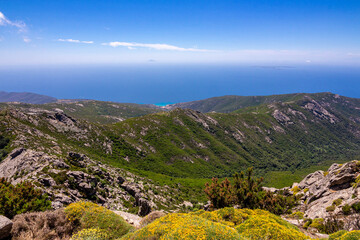 Obraz premium High angle view from summit station of Monte Capanne cable car to bay of Seccheto, Elba, Italy