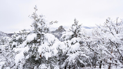 Image of the Ancient/ Abbey of San Michele built on Mount Pirchiriano located at the entrance of the Susa Valley, around the years between 983 and 987 A.D. with an abundant snowfall