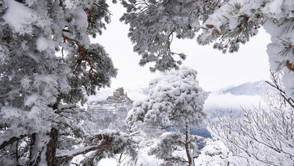 Image of the Ancient/ Abbey of San Michele built on Mount Pirchiriano located at the entrance of the Susa Valley, around the years between 983 and 987 A.D. with an abundant snowfall