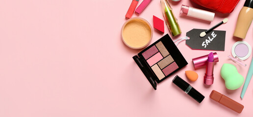 Set of makeup cosmetics and accessories for sale on pink background with space for text
