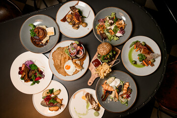 great top view of plates with different dishes on table