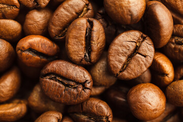 Roasted coffee beans background. Closeup. Top view
