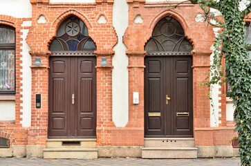 View of brick building with wooden doors