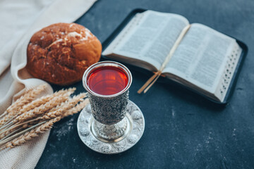 Wine, bread and open bible, communion concept