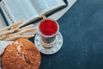 Wine, bread and open bible, communion concept
