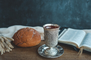 Wine, bread and open bible, communion concept