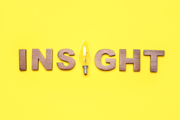 Word INSIGHT with light bulb on yellow background