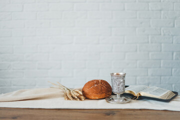 Wine, bread and open bible, communion concept