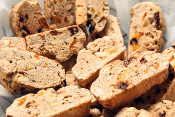 Delicious biscotti cookies in parchment, closeup