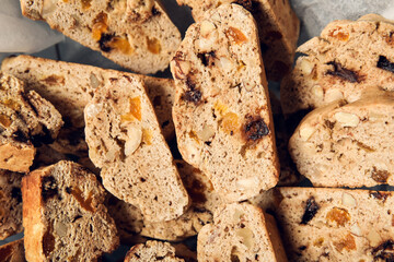 Delicious biscotti cookies in parchment, closeup